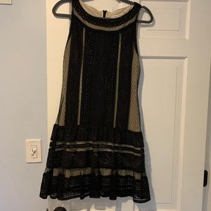 Cute Alice and Olivia dress, size 8. Black overlay with nude, lace detail